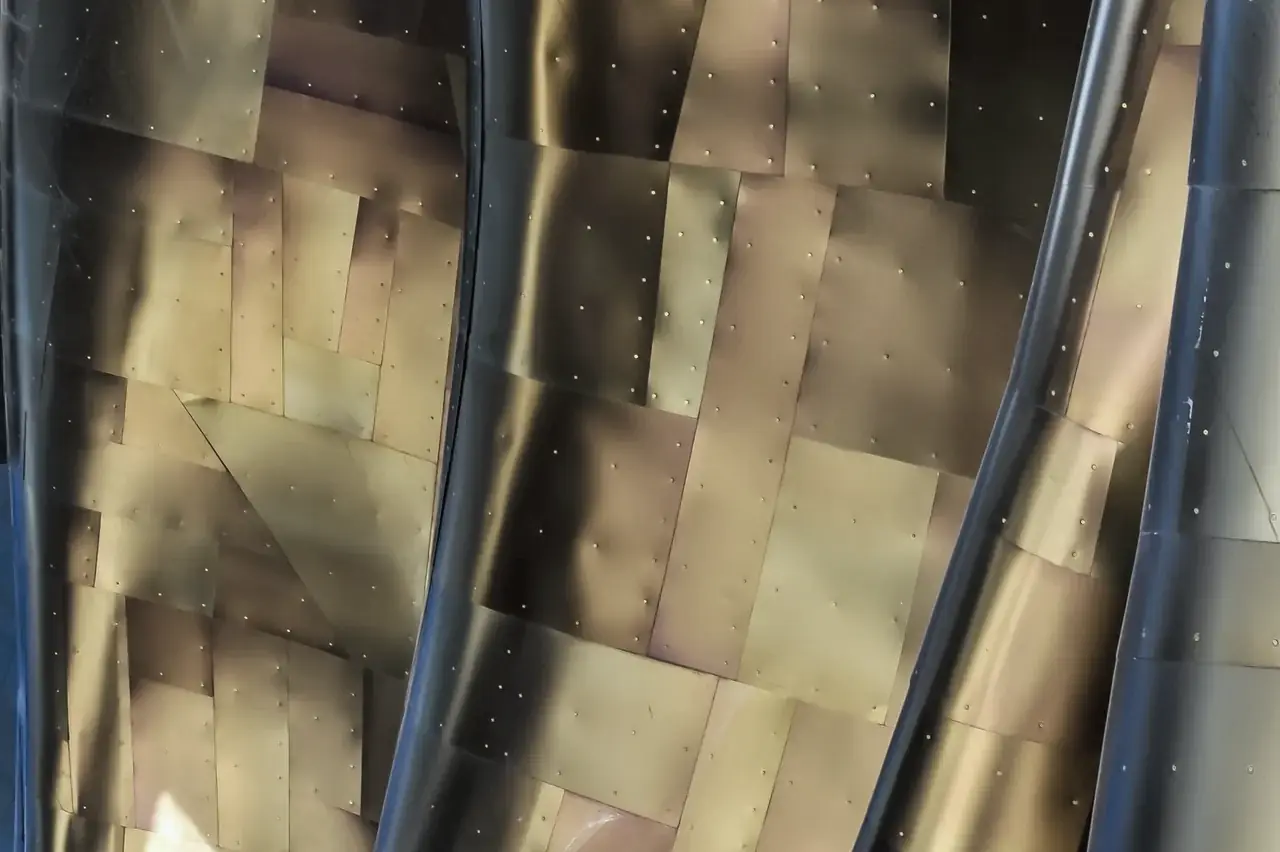 Golden designer metal panels with mirror reflections
