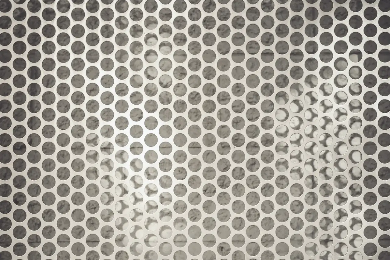 Perforated stainless steel sheet with uniform round-hole pattern