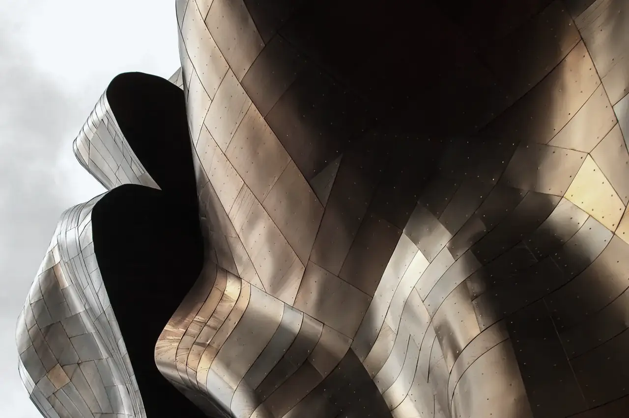 Curved metallic facade cladding on modern architecture